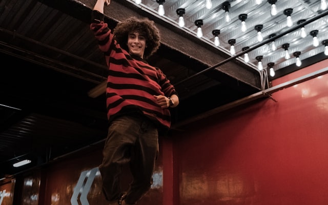 Person jumping on trampoline