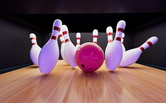 Bowling ball crashing into pins