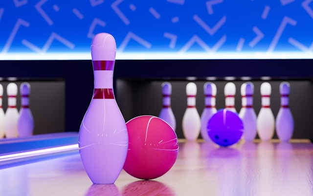 Bowling ball and pin on lane