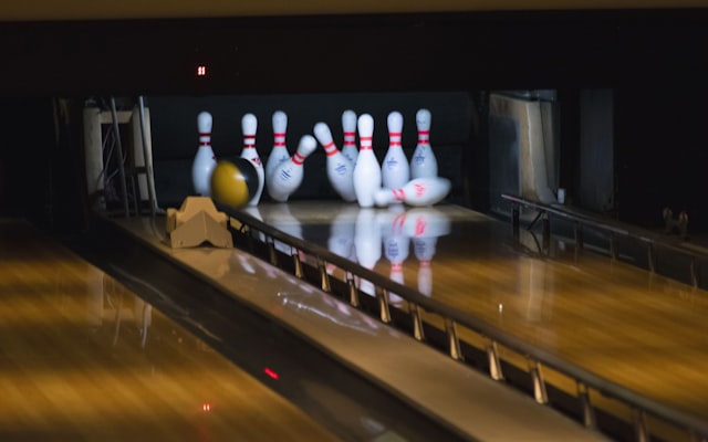 Bowling balls hitting pins