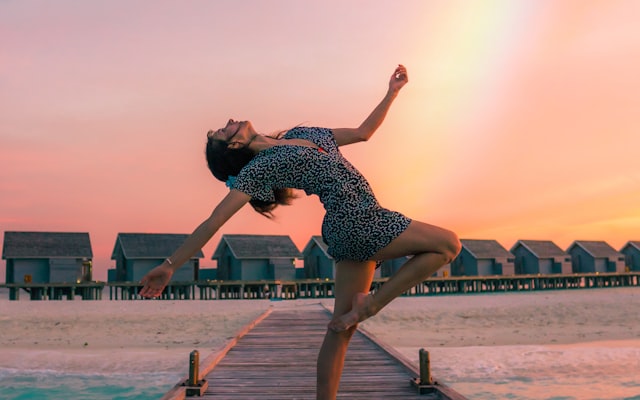 Ballet dancer stretching in a studio
