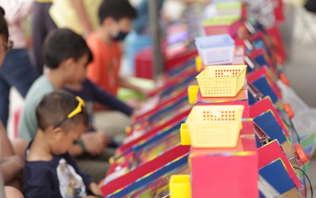 Children playing at game booths