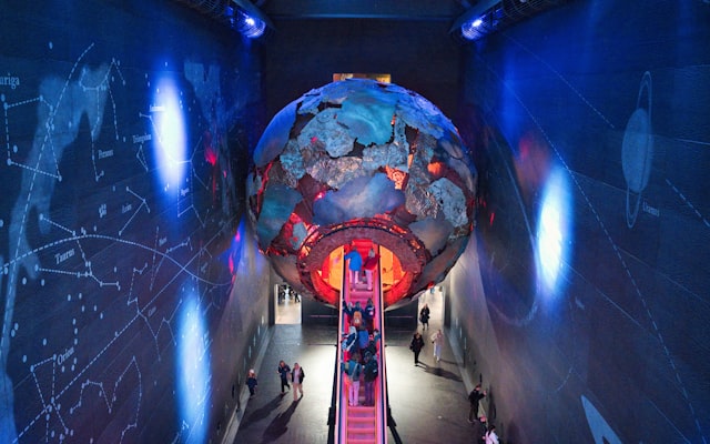 Glowing globe installation in museum