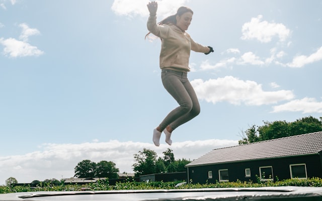 Person jumping on trampoline