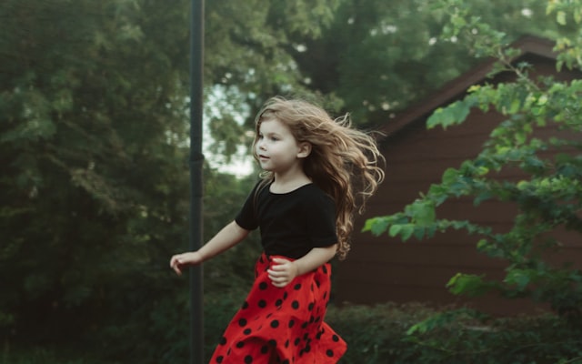 Little girl jumping on trampoline